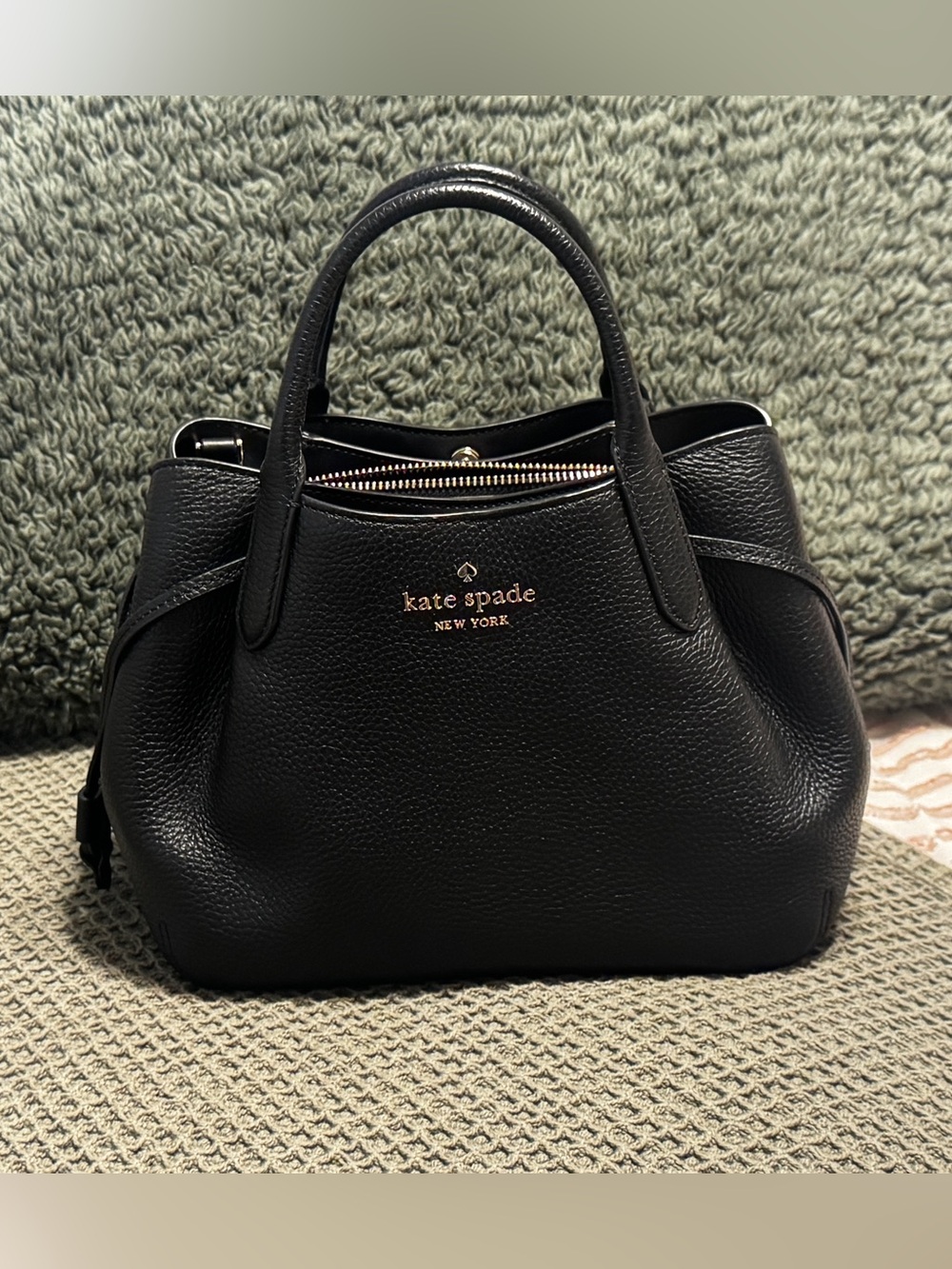 kate spade Black Pebbled Leather Small Dumpling Satchel with Gold Logo.